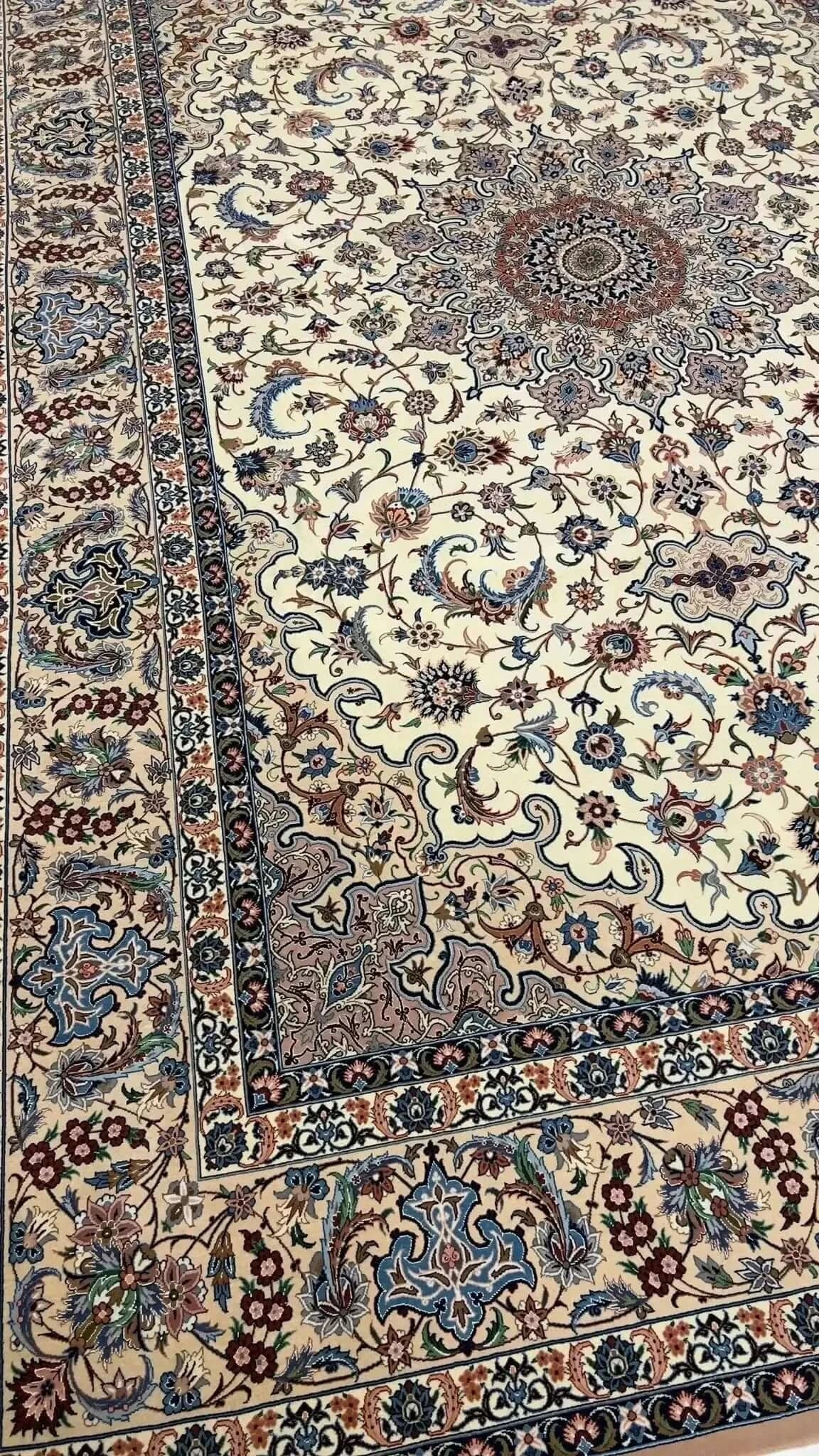 "Isfahan Persian rug by Ahmad Zojaji, knotted by hand with a wool and silk pile and silk warp. This large rug measures 300 cm x 200 cm (9.8 feet x 6.5 feet) and has a knot density of 810,000 knots per square meter. A beautiful floral design, this new rug from Iran offers both elegance and craftsmanship, with only one available in stock."