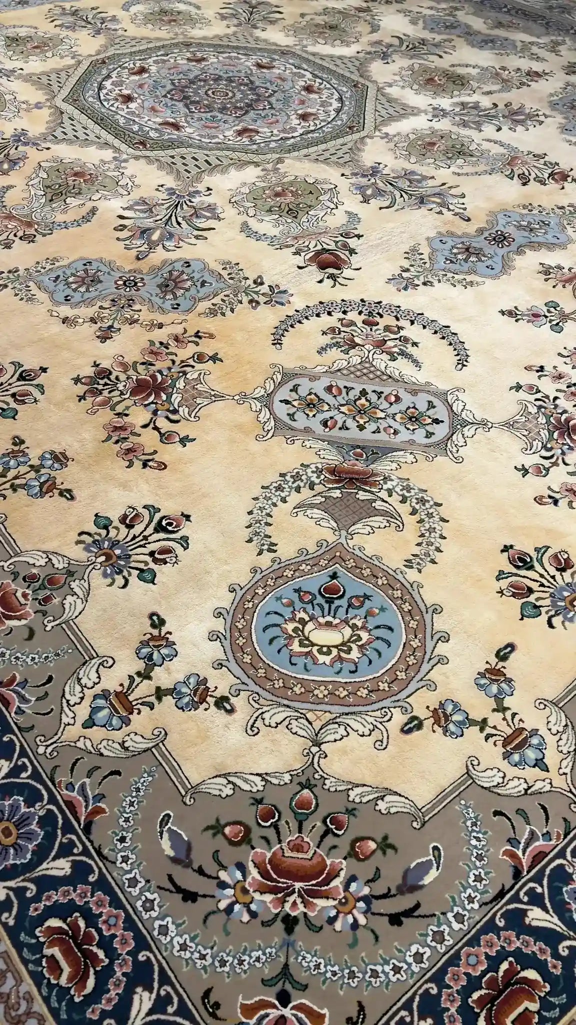 Handwoven Isfahan Persian rug with silk highlights, displaying intricate craftsmanship and eco-friendly natural dyes.
