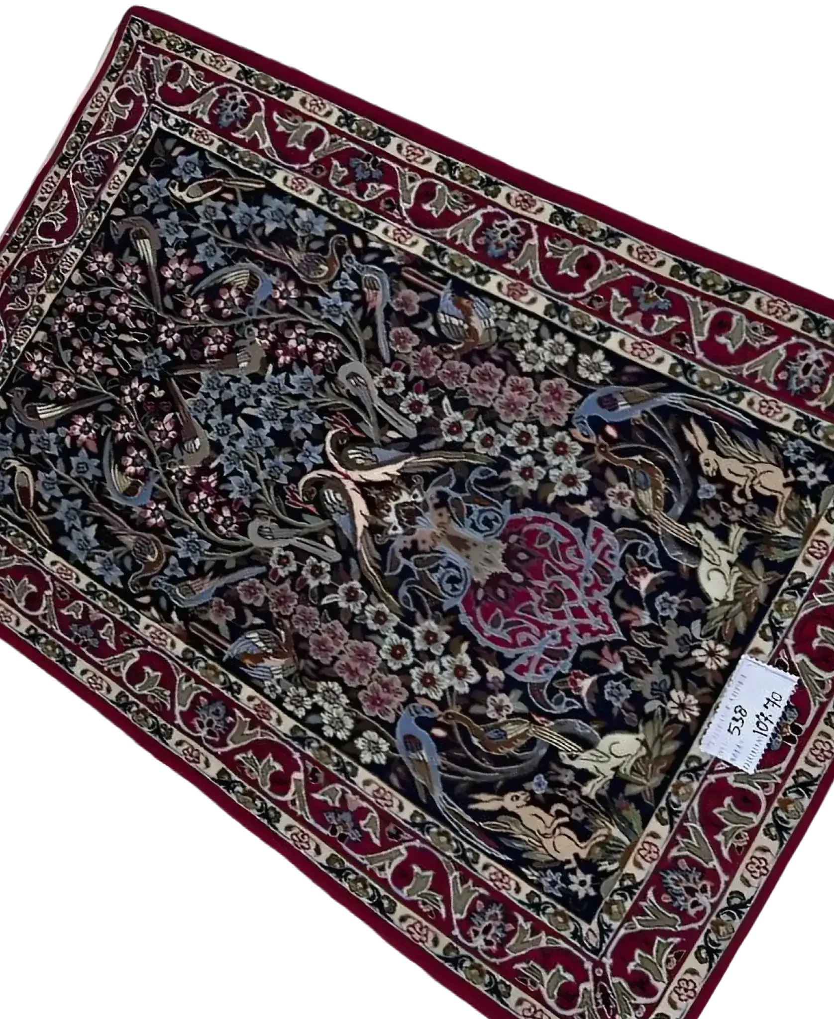 "Unique Persian rug from Isfahan, knotted by hand with wool and silk. Measuring approximately 107 cm x 70 cm (3.5 x 2.3 feet), this exquisite rug boasts a rich texture and intricate design, ideal for enhancing any living room or luxury space."