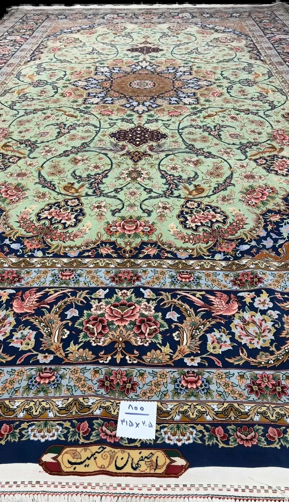 Traditional light green Persian carpet showcasing handcrafted design details