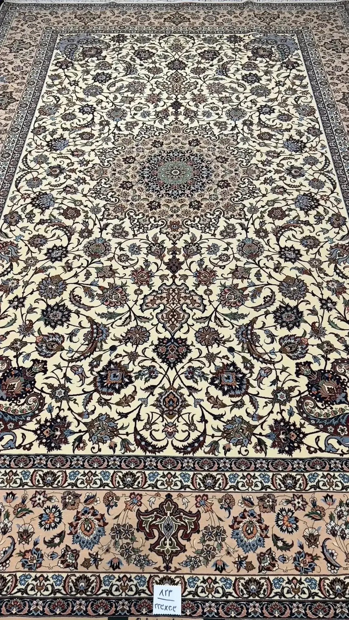 Luxurious Persian carpet knotted by hand in Isfahan, featuring an intricate floral medallion pattern, with a knot density of 810,000 per m².

