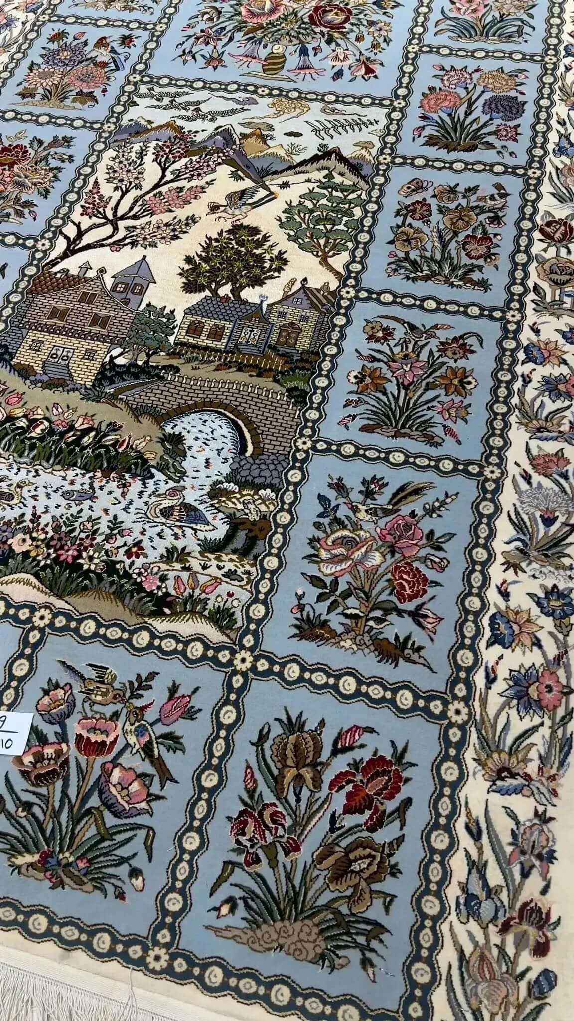 "Beautiful Isfahan Persian carpet, 165 cm x 110 cm, featuring floral and scenic patterns, made with wool and silk, available for sale online."

