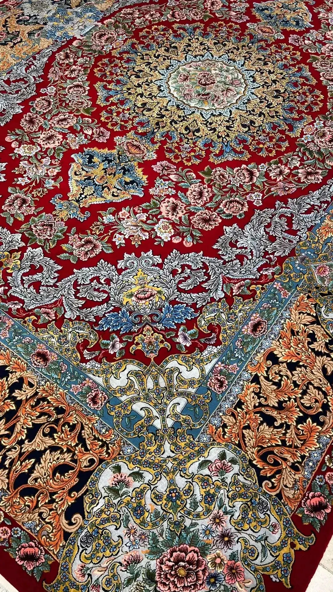 Close-up of Saeed Davarie’s hand-woven Persian rug with detailed medallions
