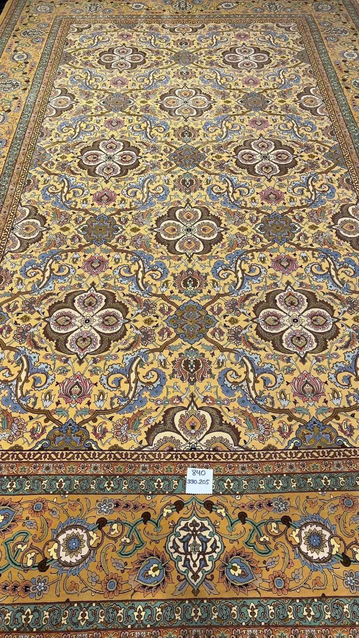 Handcrafted wool and silk carpet by Master Weaver Haghieghie with intricate patterns