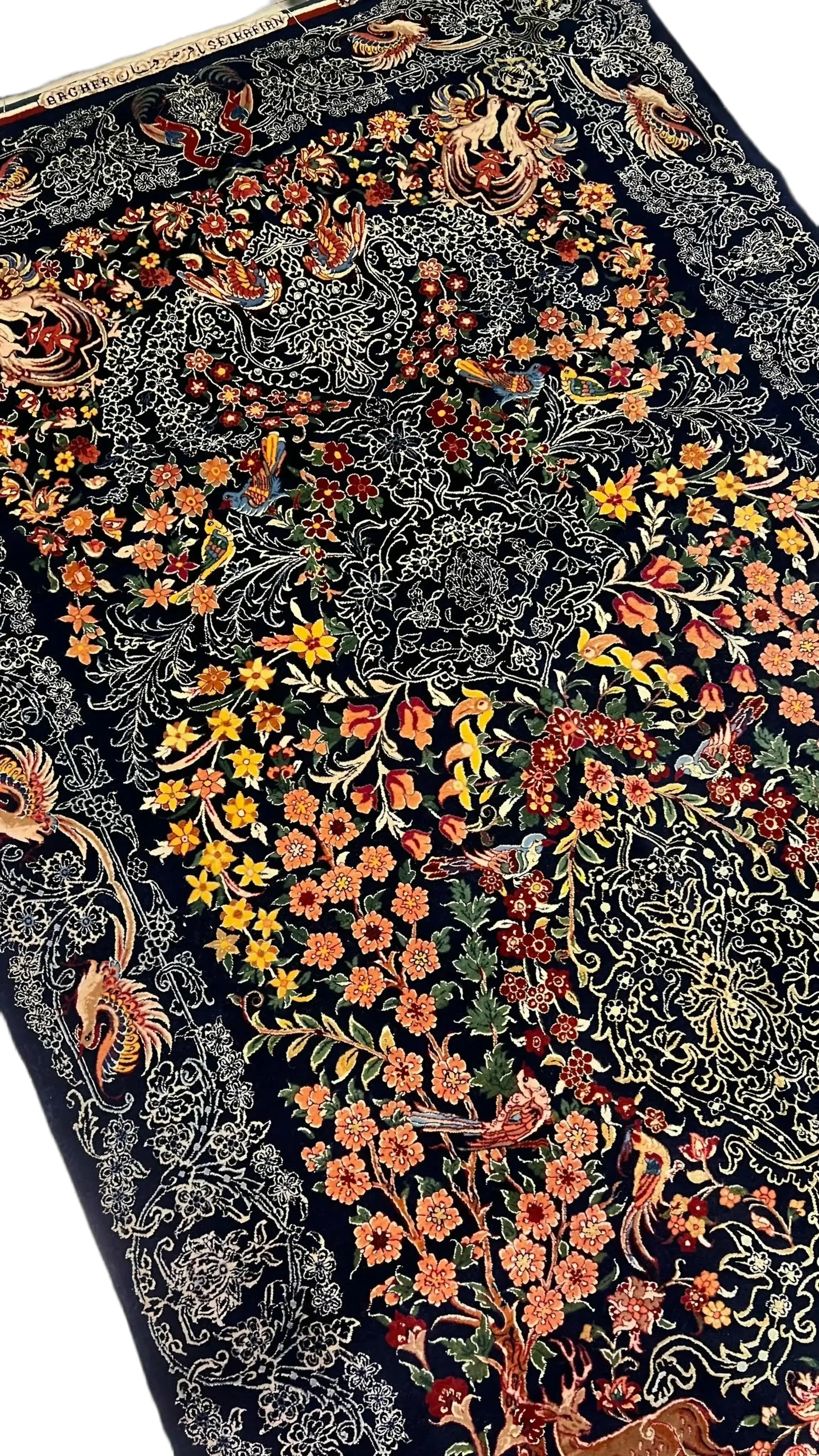 Close-up of Seirafian Persian rug with detailed floral designs