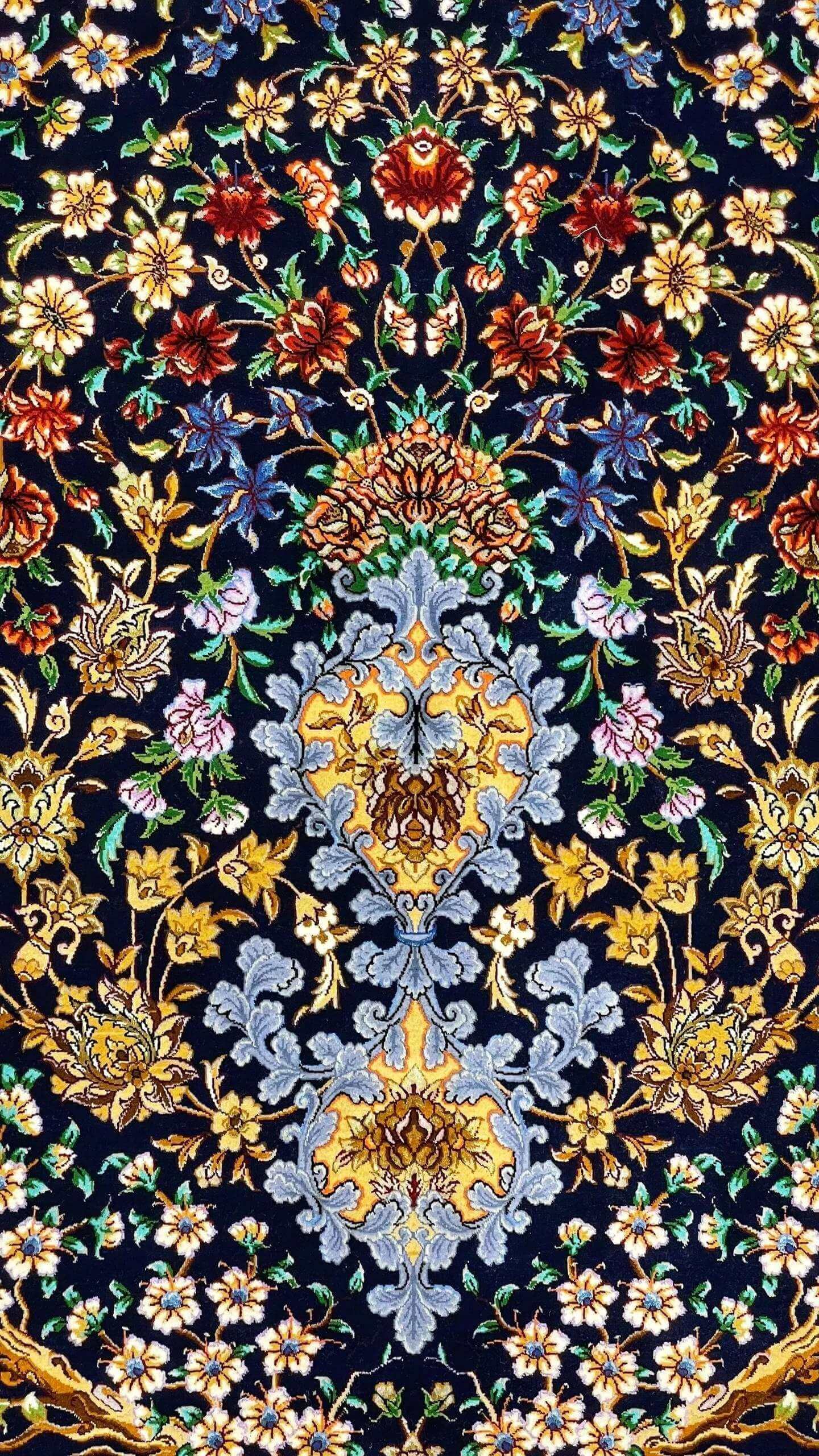 Close-up view of Isfahan Bartarian Tree of Life Persian rug with intricate floral motifs