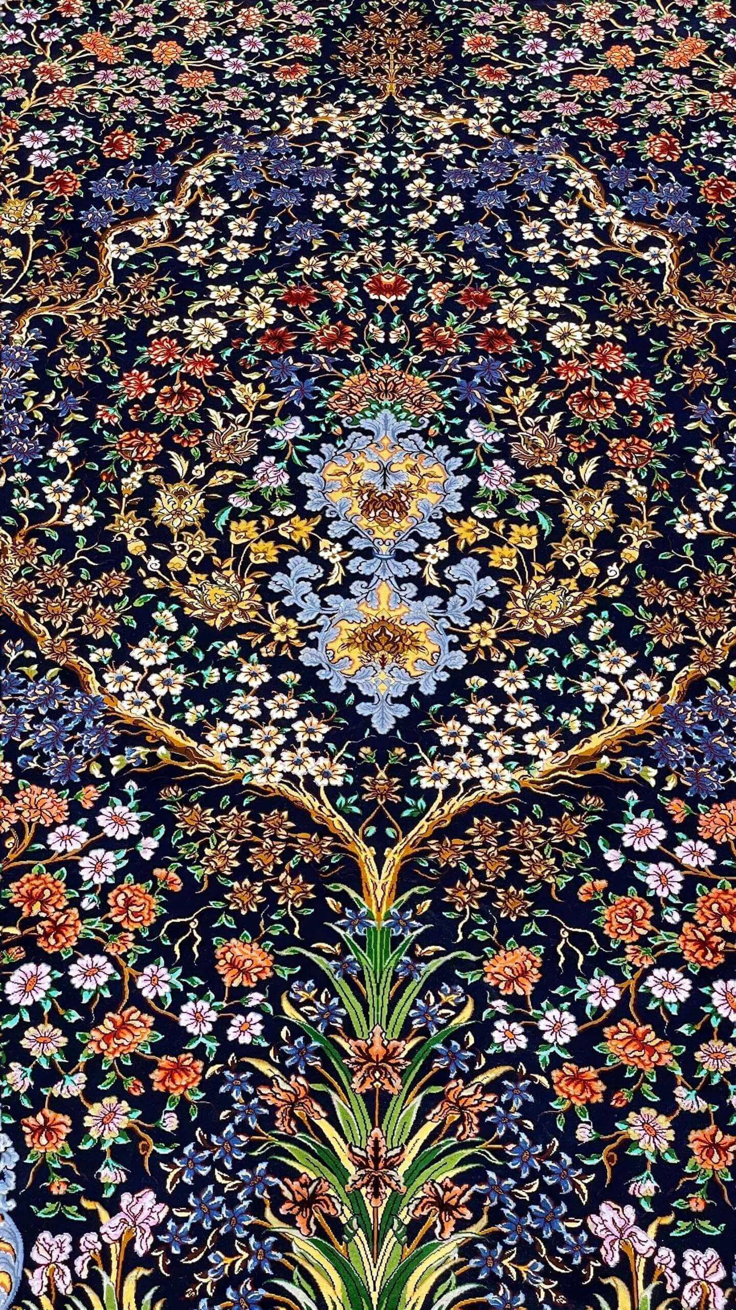 Persian Isfahan rug with a dense Tree of Life floral design and artisanal craftsmanship