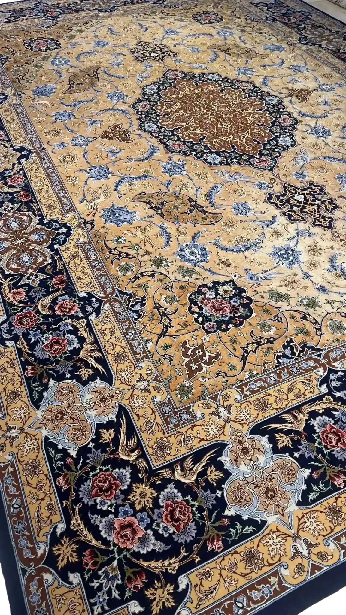 Isfahan Persian Silk and Wool Rug with Detailed Floral Design
A finely detailed Persian rug from Isfahan, Iran, made from a blend of 70% silk and wool. The 320x220 cm (10.5x7.2 feet) rug showcases elegant floral patterns and superior craftsmanship by Master Hassan Dardashtie, perfect for adding a touch of luxury to any room.