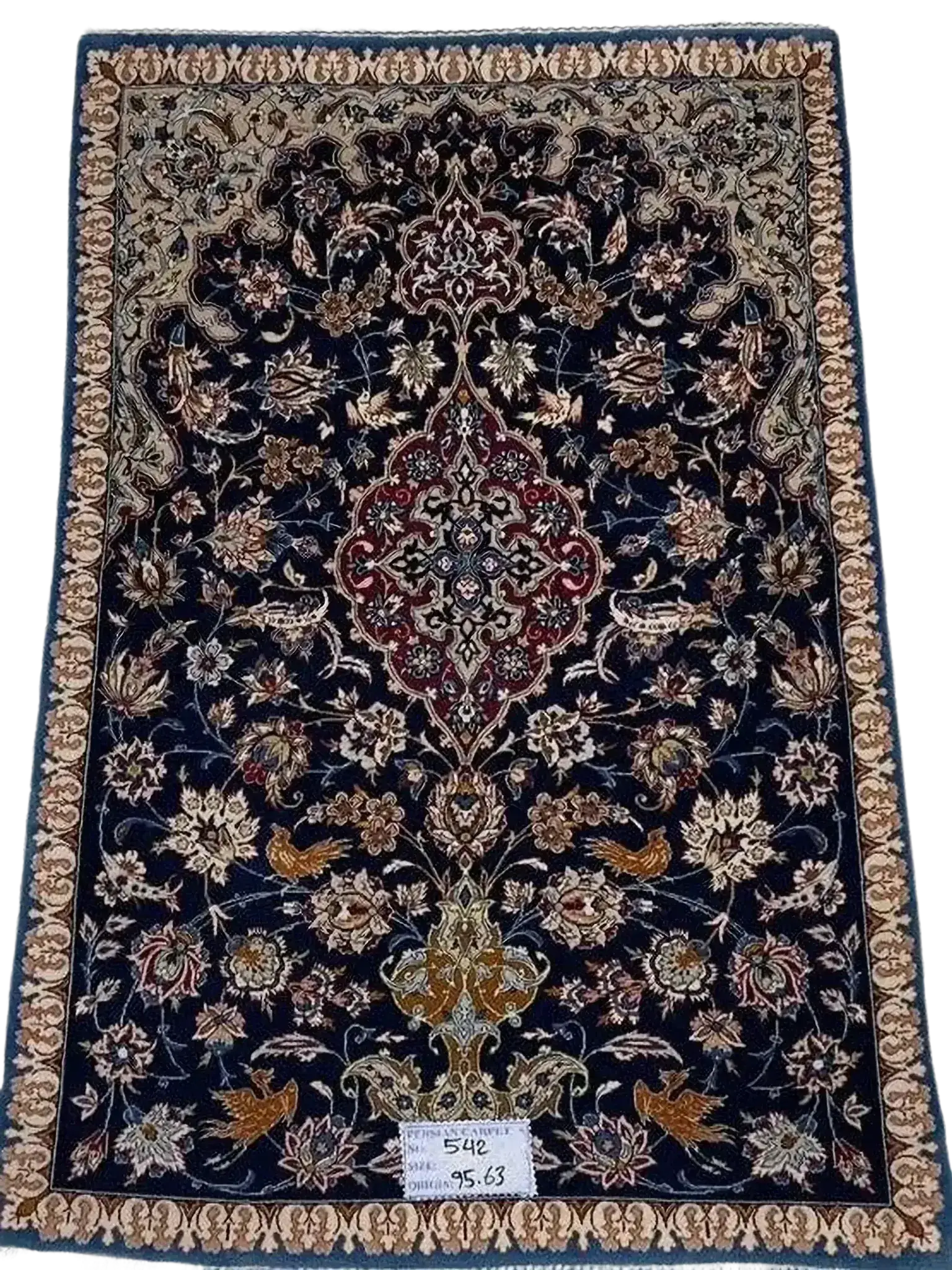 "Small vintage Persian carpet, hand-knotted in Isfahan, Iran, measuring 95 cm x 63 cm (3.1 x 2.1 feet). Made with wool and silk, this 70-year-old rug is in great condition, featuring intricate designs that reflect its rich heritage."