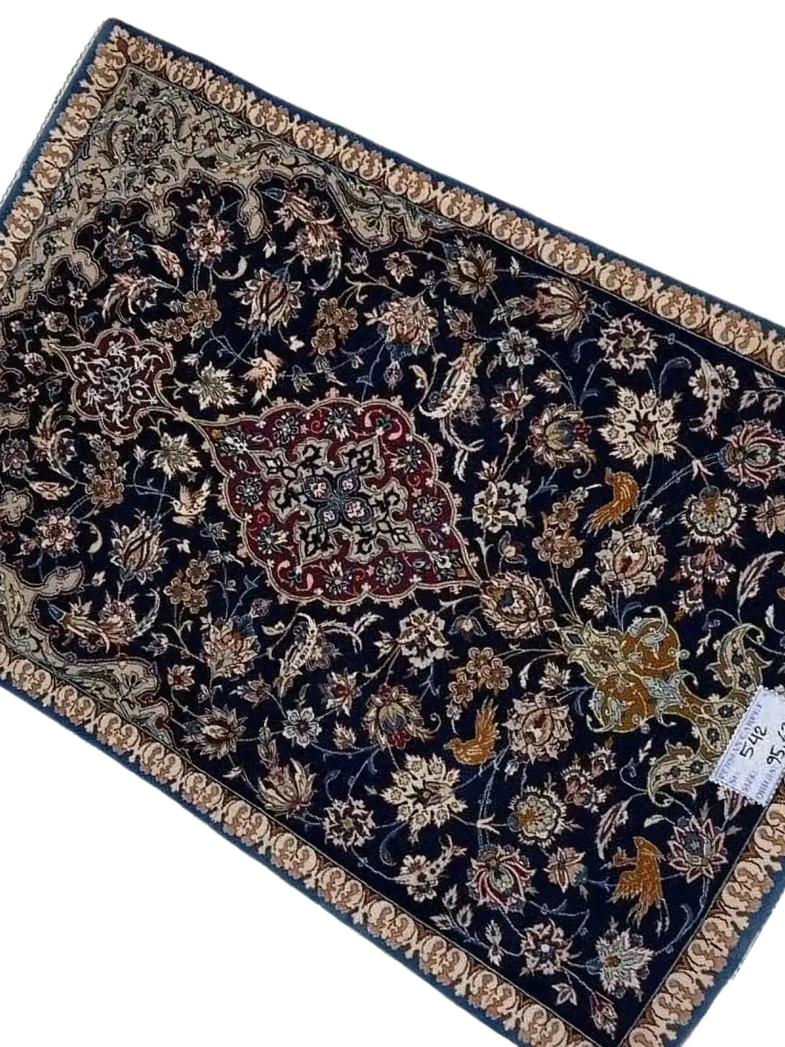 "Hand-knotted Persian carpet from Isfahan, made with wool and silk. This small rug, approximately 70 years old, measures 95 cm x 63 cm (3.1 x 2.1 feet) and showcases traditional craftsmanship, perfect for adding history and elegance to any room."