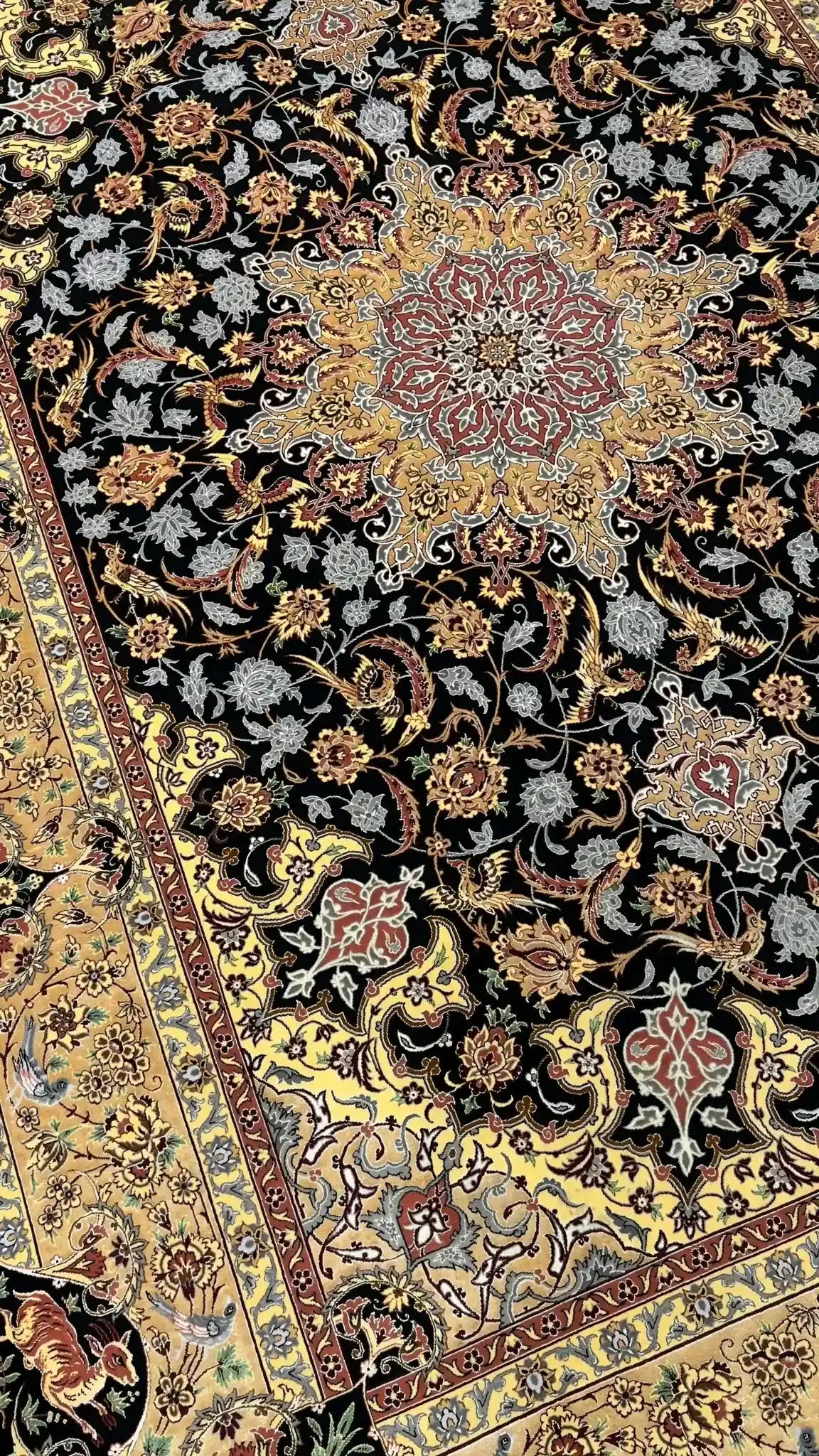 Dardashtie's luxurious black and gold oriental rug with intricate patterns