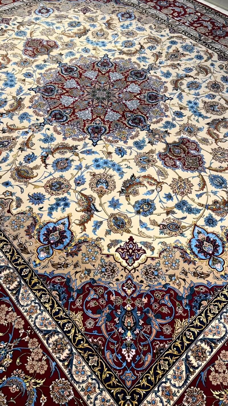 "Detailed floral patterns on wool and silk Persian rug"
