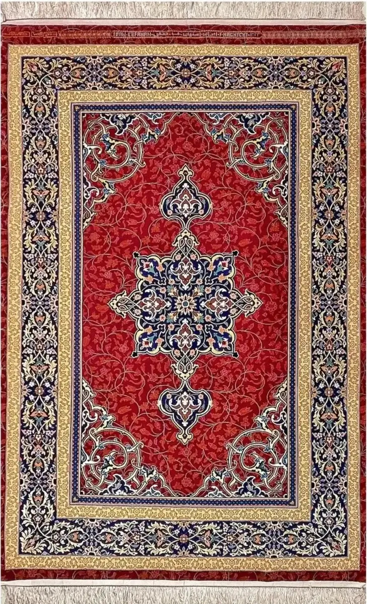 Persian Area Rug by Ali Reza Haghighie - Top view of an intricate handmade Persian rug featuring a central medallion design, woven with wool and silk in rich red, navy, and gold hues.

