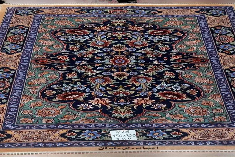 "Hand-knotted Persian rug crafted by Ali Samani in Isfahan, featuring intricate floral patterns in vibrant colors, made from a luxurious blend of wool and silk, perfect for enhancing home decor."

