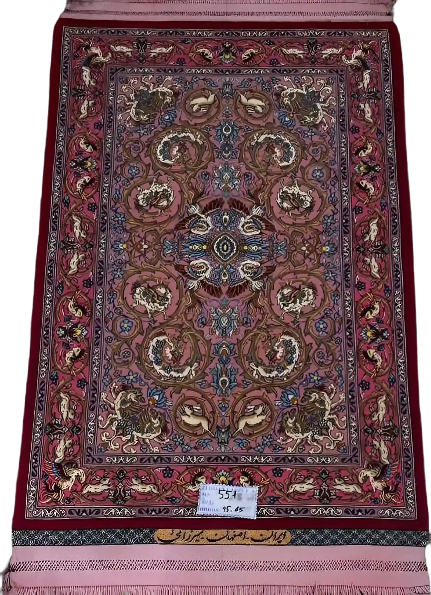 "Hand-knotted Persian rug from Isfahan, 95x65 cm, crafted by Mirzaie with wool and silk, featuring intricate designs and high knot density (810,000 knots/m²). Authentic Persian craftsmanship."


