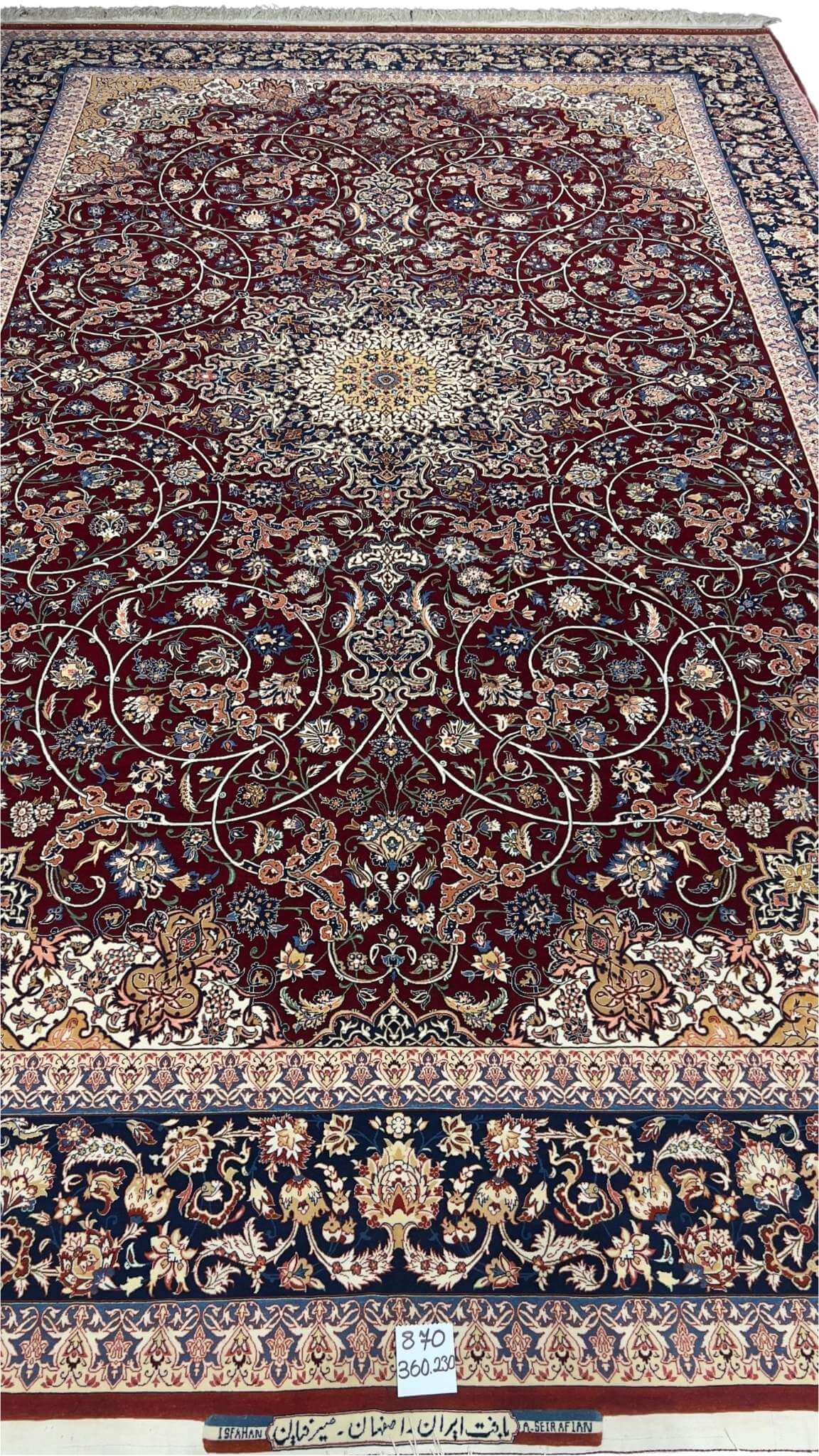 "Hand-knotted Isfahan rug by Grand Master Ali Seirafian with intricate medallion design."
