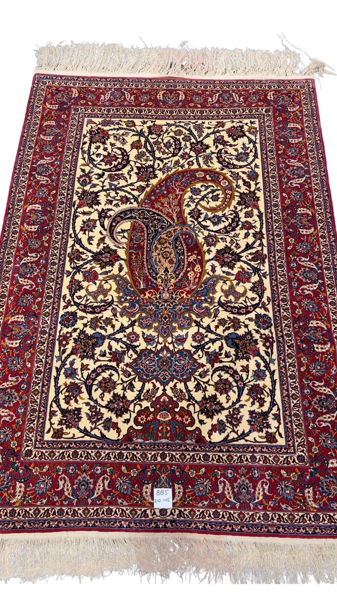  80-year-old antique Persian rug with intricate floral designs, 210 x 145 cm.